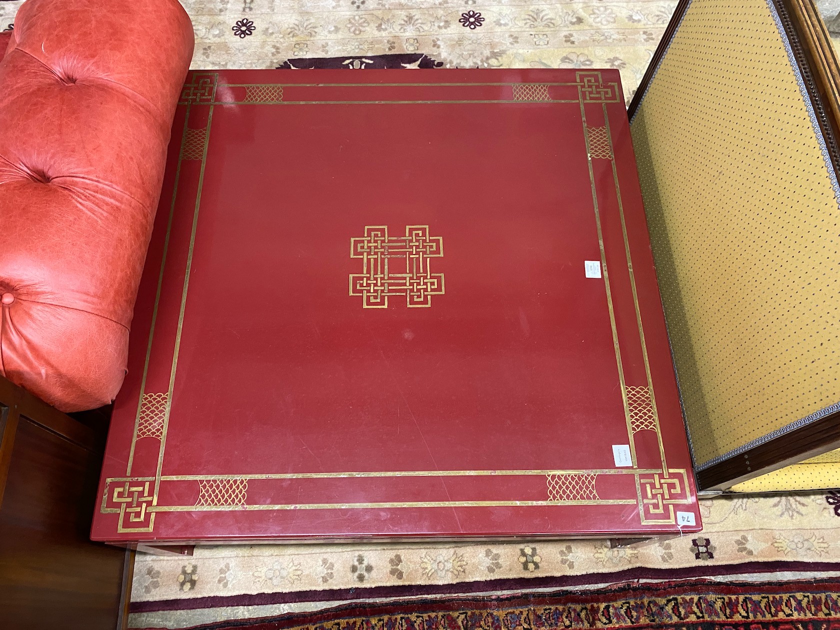 A Chinese style red lacquer square coffee table, 110cm, height 40cm
